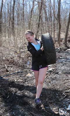 Katie carrying tire