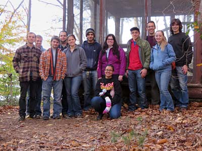 Group in front of cabin