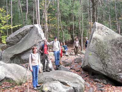 Group hiking between boulders