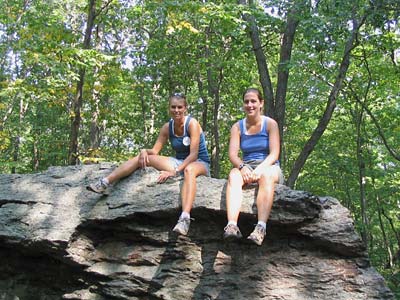 Lana and Ashley on top of split boulder